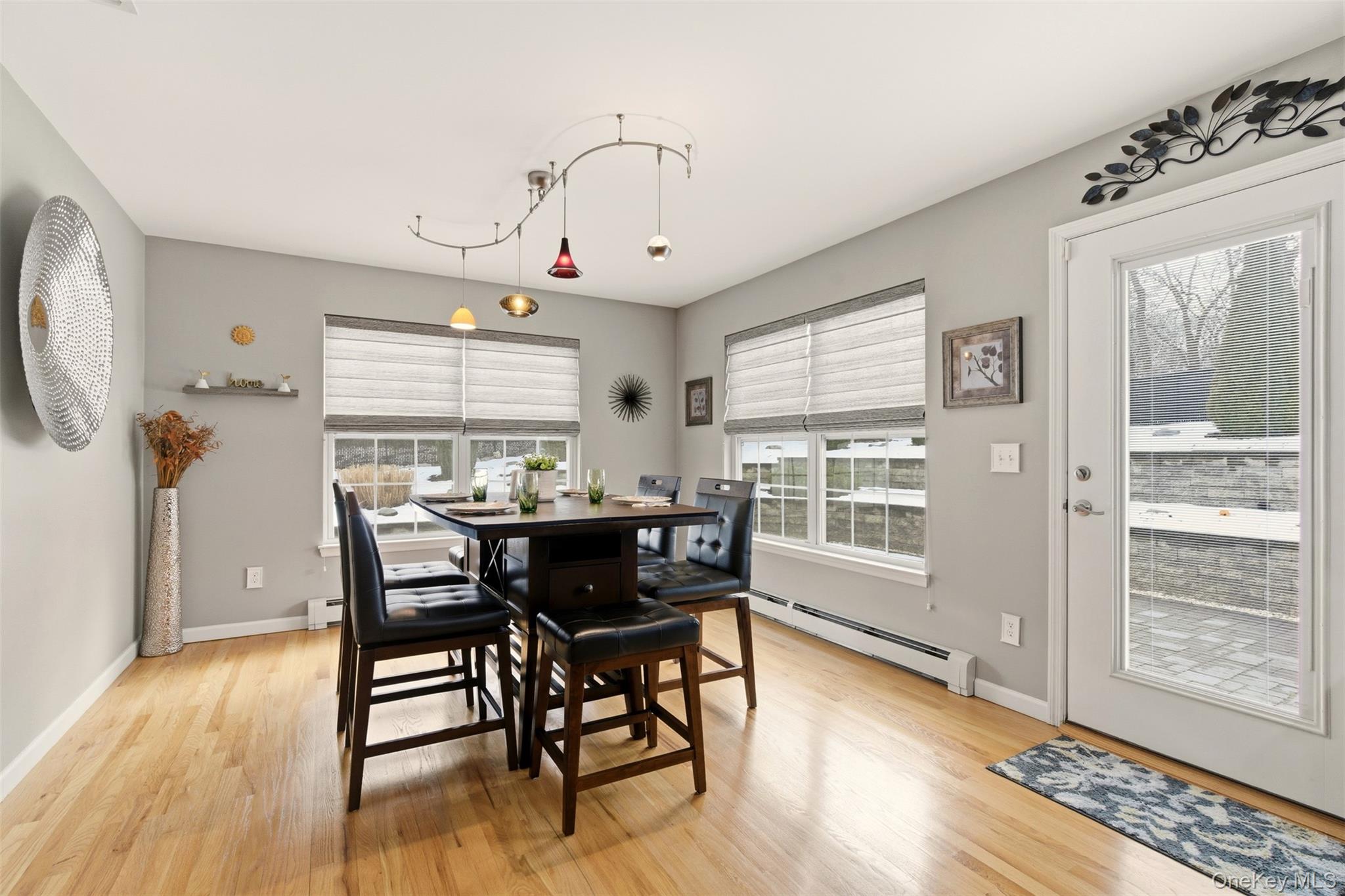 4 Macintosh Lane Selden, NY 11784 - Photo 5 of 30 a view of a dining room with furniture window and wooden floor