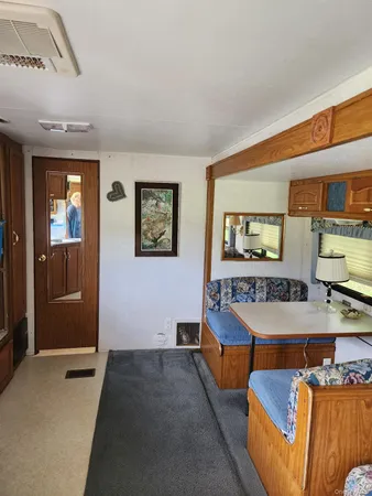 a kitchen with a sink cabinets and a wooden floor