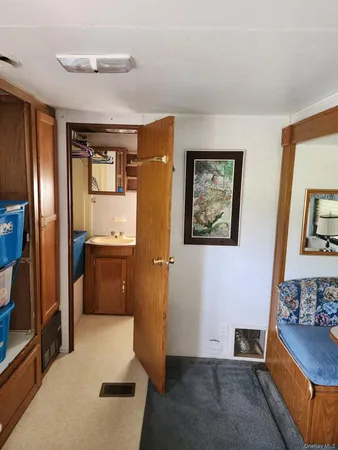 a bedroom with a bed and a television