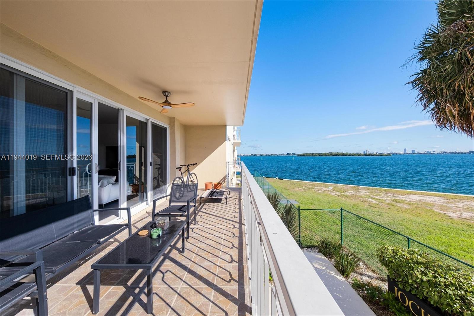 11111 Biscayne Boulevard, Unit 2D Miami, FL 33181 - Photo 11 of 26 a view of balcony with wooden floor and outdoor seating
