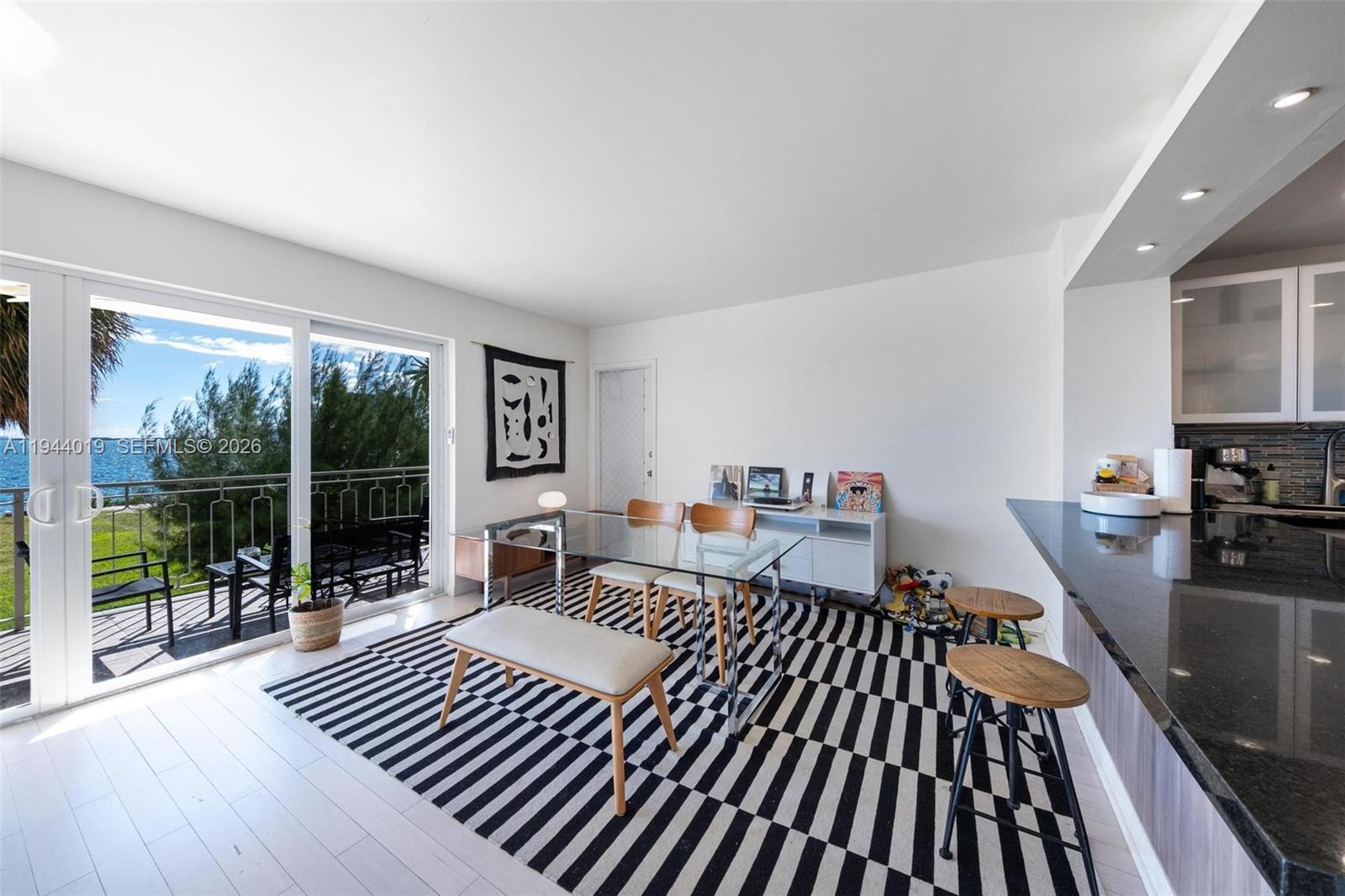 11111 Biscayne Boulevard, Unit 2D Miami, FL 33181 - Photo 5 of 26 a living room with furniture