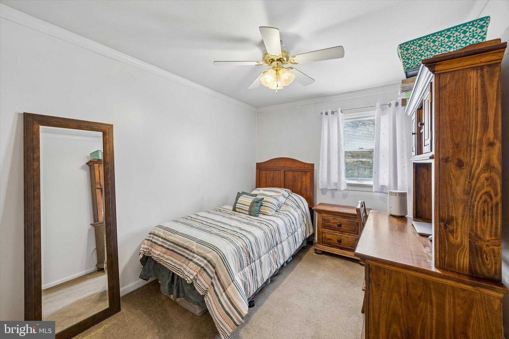 3212 Atmore Road Philadelphia, PA 19154 - Photo 17 of 25 a bedroom with a bed and a chandelier
