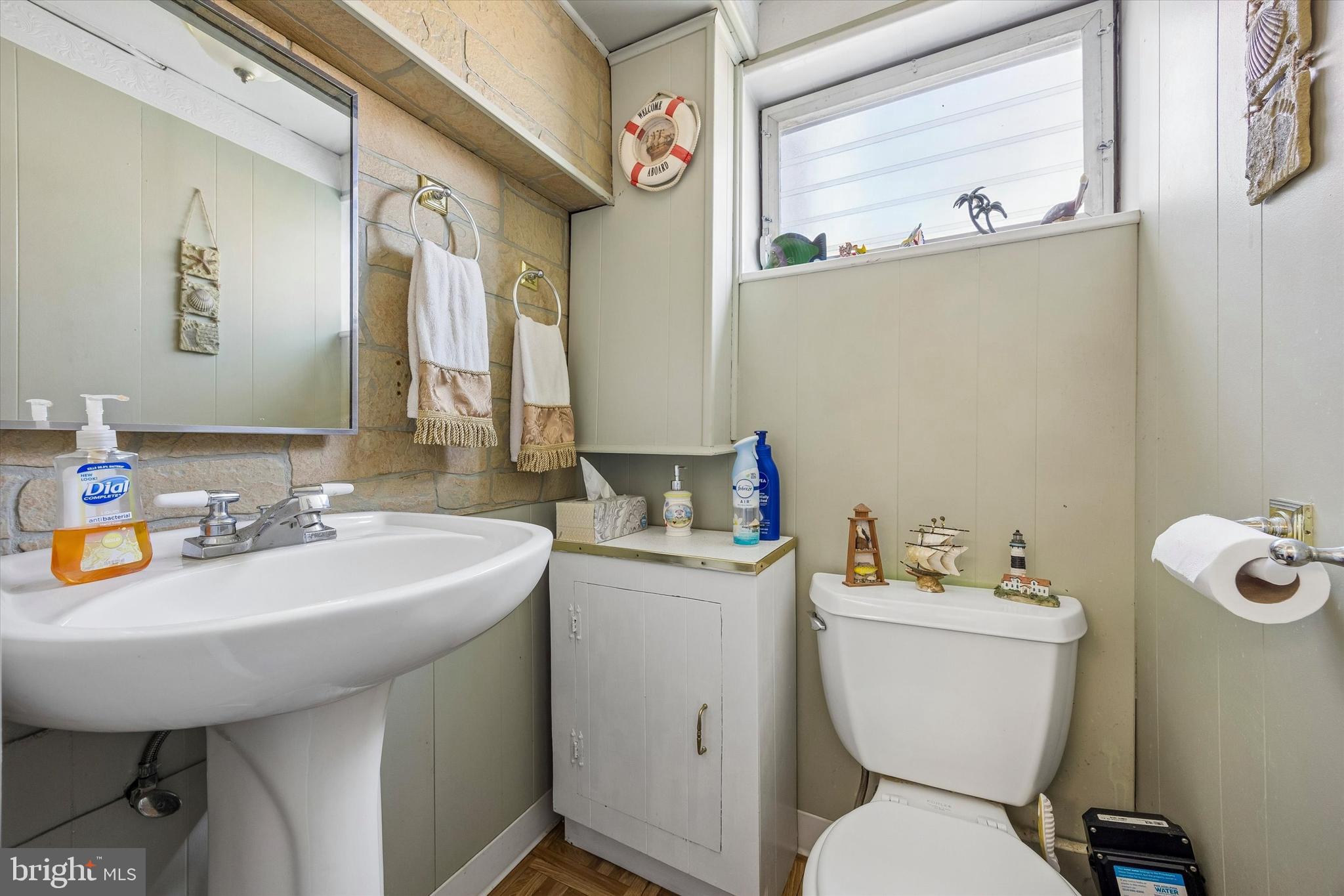3212 Atmore Road Philadelphia, PA 19154 - Photo 21 of 25 a bathroom with a sink mirror and toilet