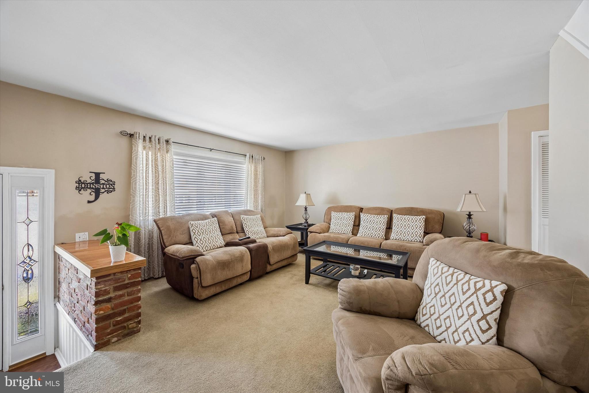 3212 Atmore Road Philadelphia, PA 19154 - Photo 4 of 25 a living room with furniture and a large window