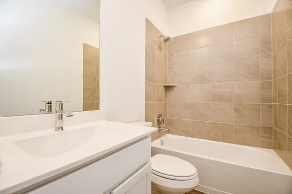 a bathroom with a sink a toilet and bathtub
