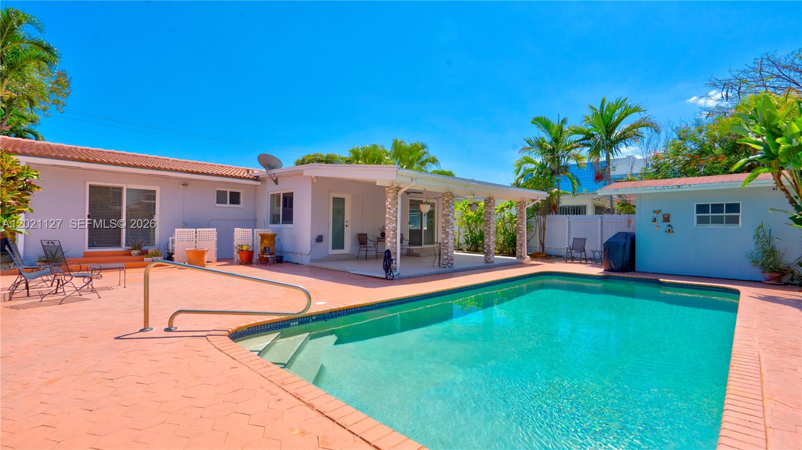 3611 Southwest 23rd Street Miami, FL 33145 - Photo 2 of 56 3613 - Large private backyard with pool accessible from side yard entrance, Primary bedroom, laundry room and florida room with pool deck, terrace and storage shed