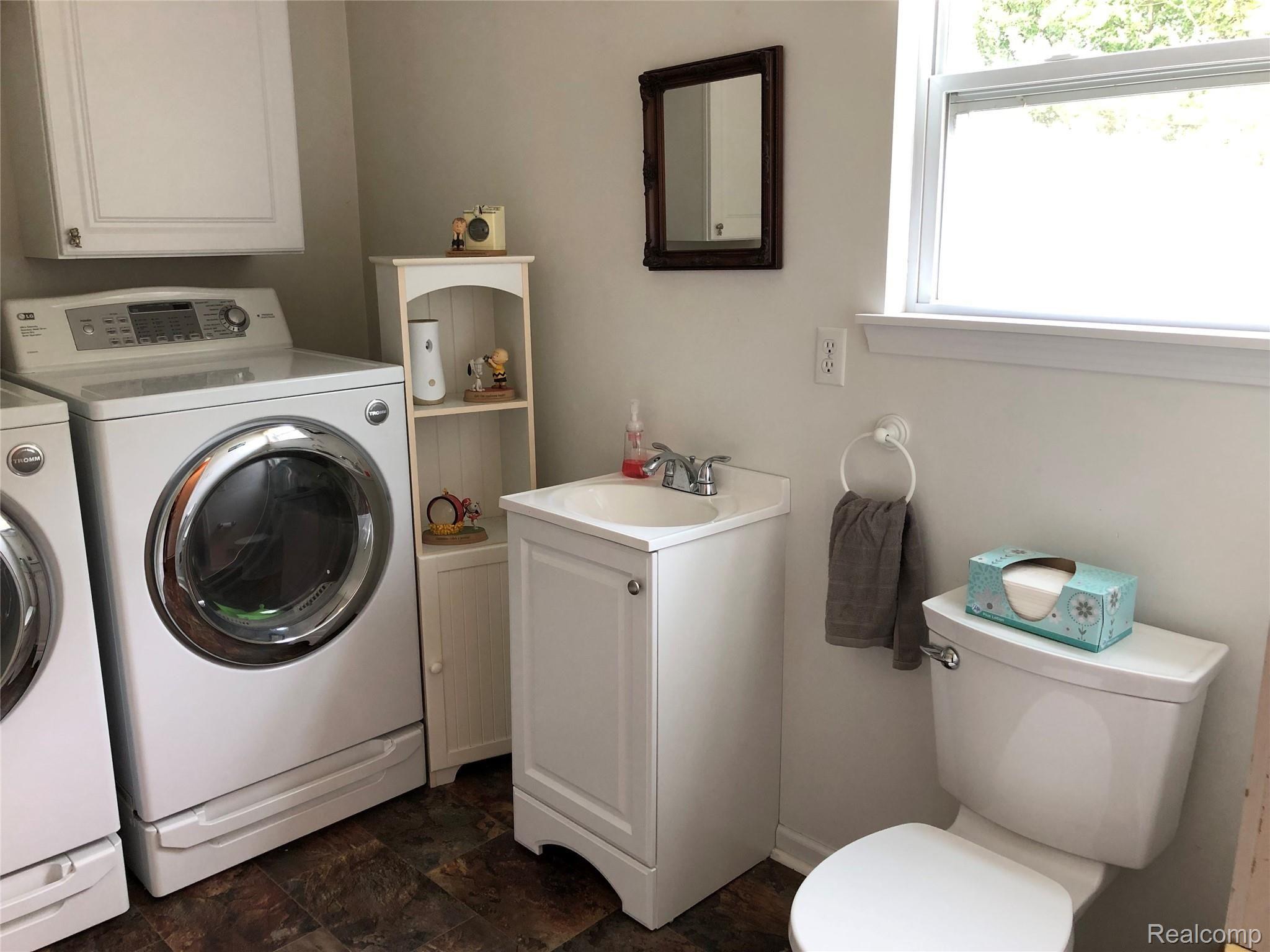 5171 Martin Road Capac, MI 48014 - Photo 23 of 34 Half-bath combined with laundry room located conveniently off the kitchen