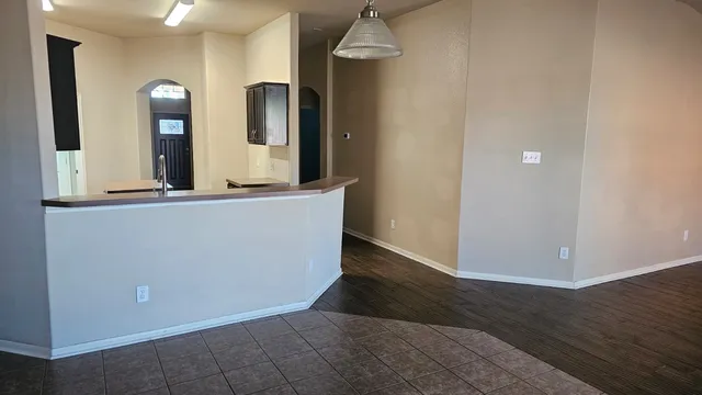 hallway with mirror and window