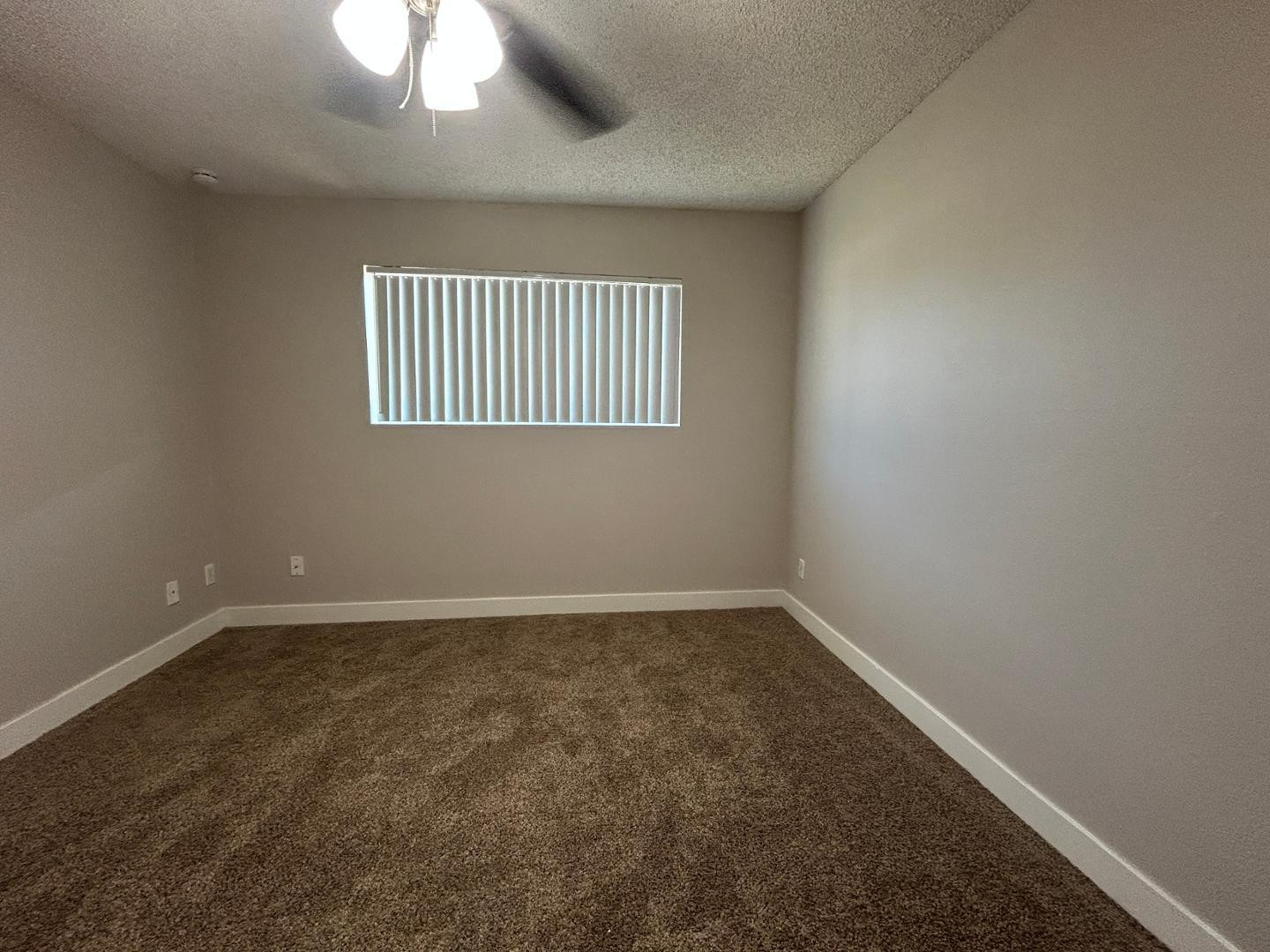 859 South Ext Road Mesa, AZ 85210 - Photo 8 of 19 an empty room with a window