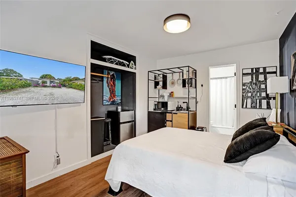 a kitchen with stainless steel appliances granite countertop a refrigerator and microwave