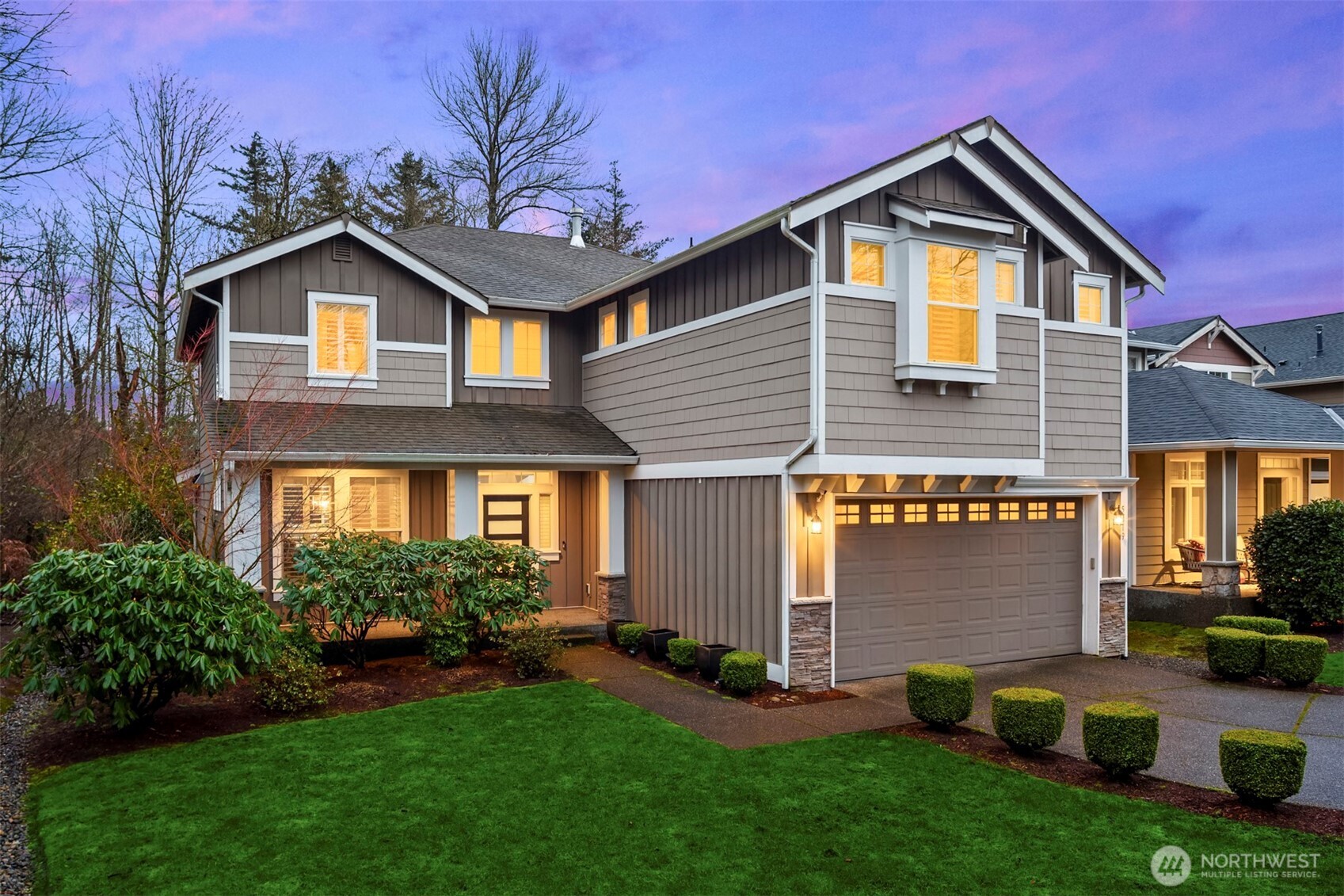 5819 Northeast 1st Street Renton, WA 98059 - Photo 1 of 38 a front view of a house with garden