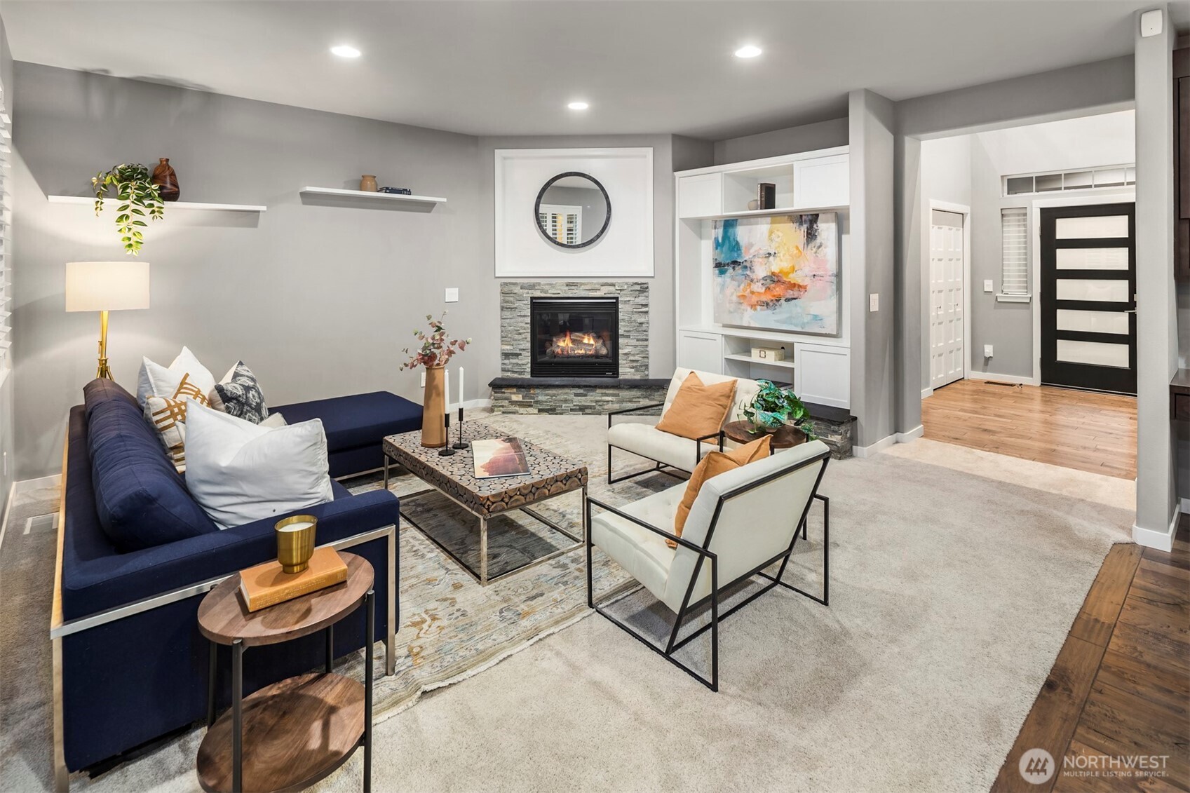 5819 Northeast 1st Street Renton, WA 98059 - Photo 11 of 38 a living room with furniture and a fireplace