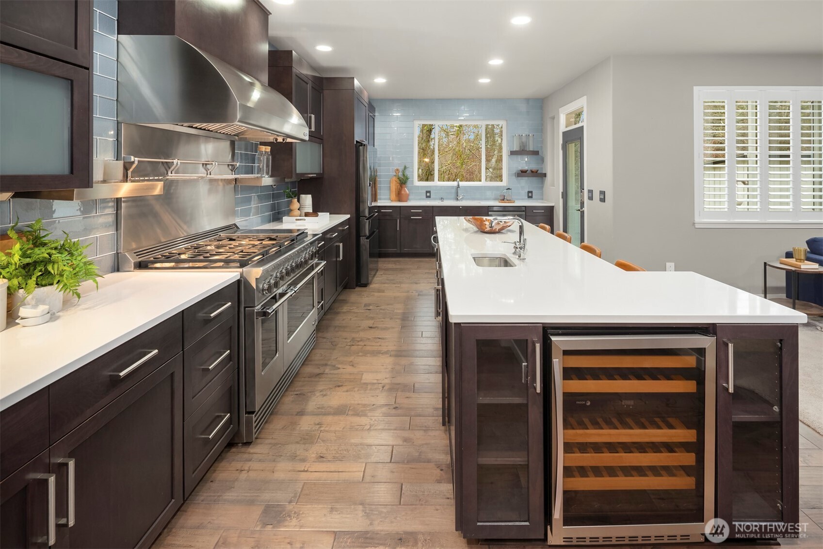 5819 Northeast 1st Street Renton, WA 98059 - Photo 13 of 38 a large kitchen with stainless steel appliances granite countertop a stove and a sink