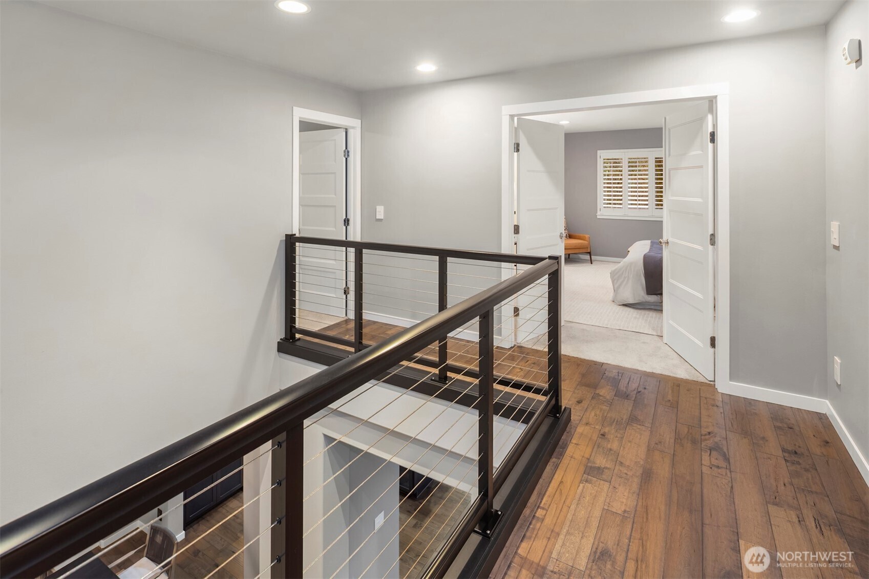 5819 Northeast 1st Street Renton, WA 98059 - Photo 22 of 38 a view of a hallway with wooden floor and stairs