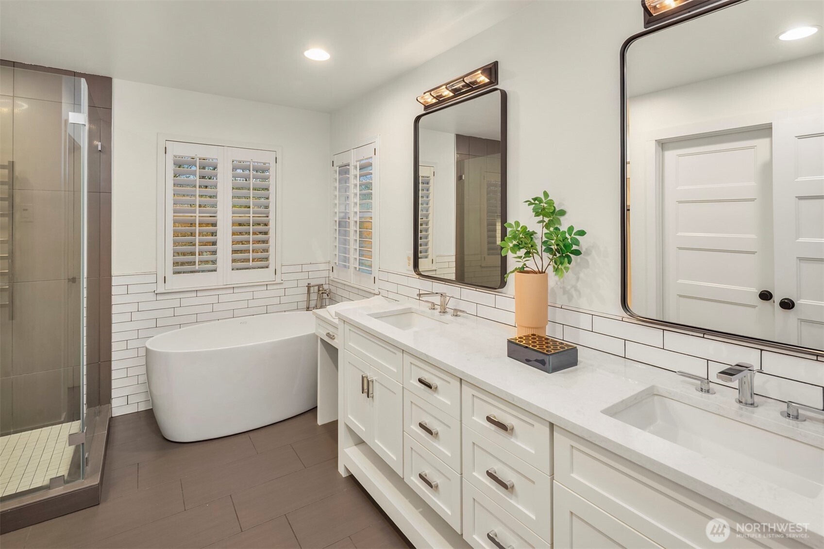 5819 Northeast 1st Street Renton, WA 98059 - Photo 25 of 38 a bathroom with a tub sink and mirror