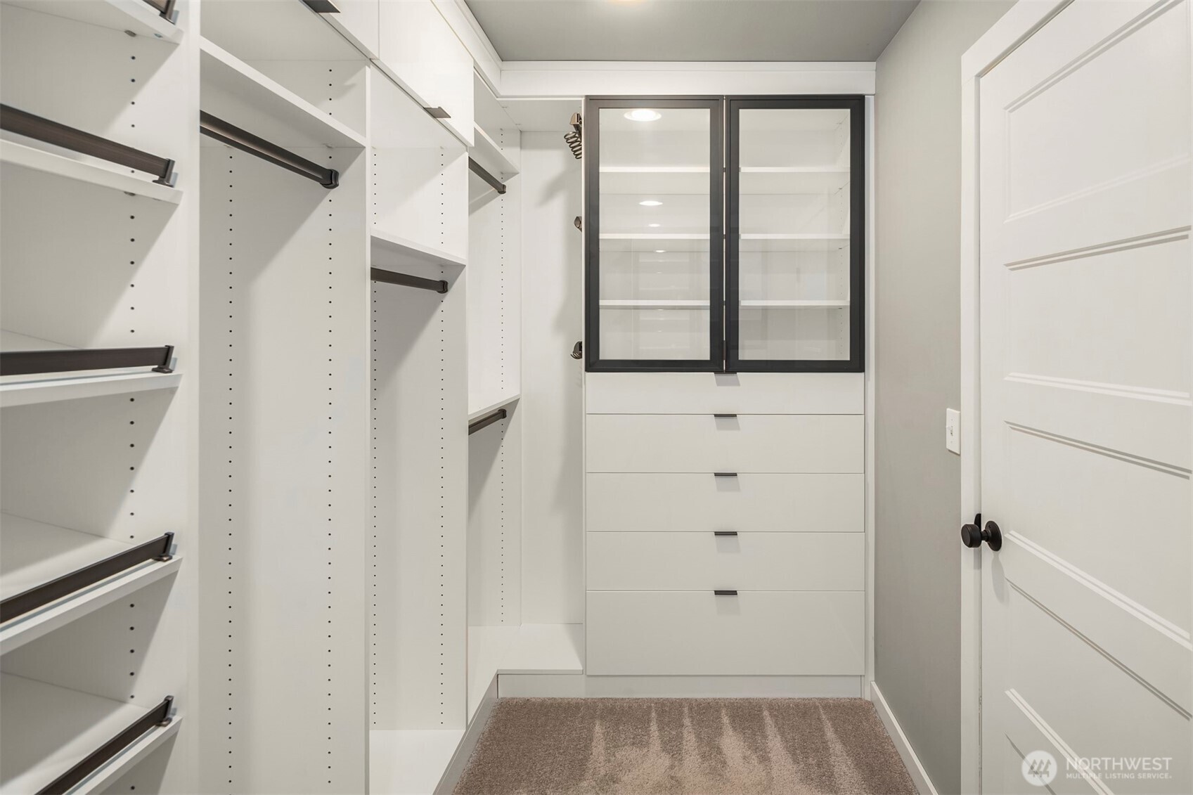 5819 Northeast 1st Street Renton, WA 98059 - Photo 28 of 38 a view of walk in closet with wooden floor