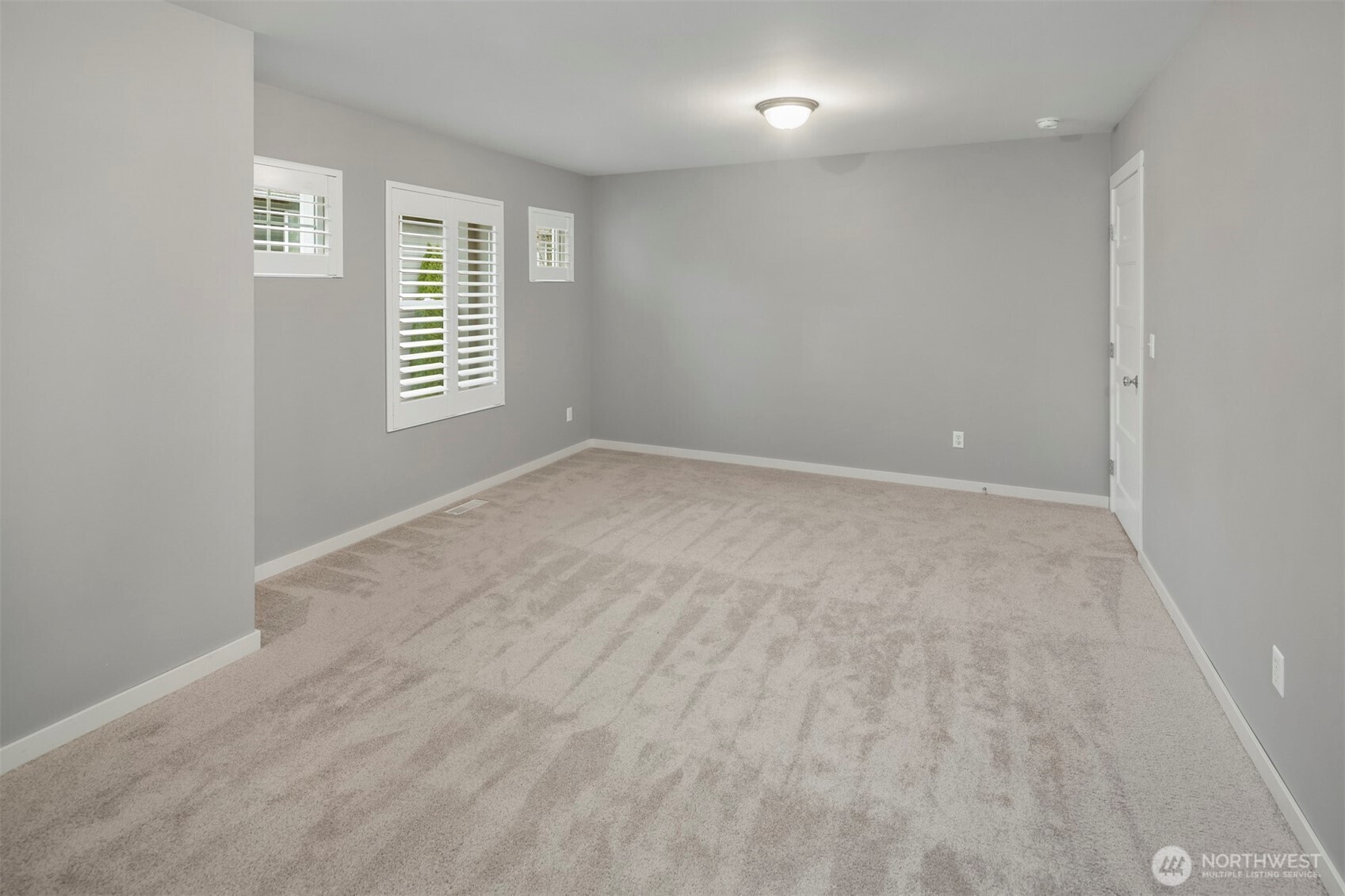 5819 Northeast 1st Street Renton, WA 98059 - Photo 29 of 38 an empty room with windows