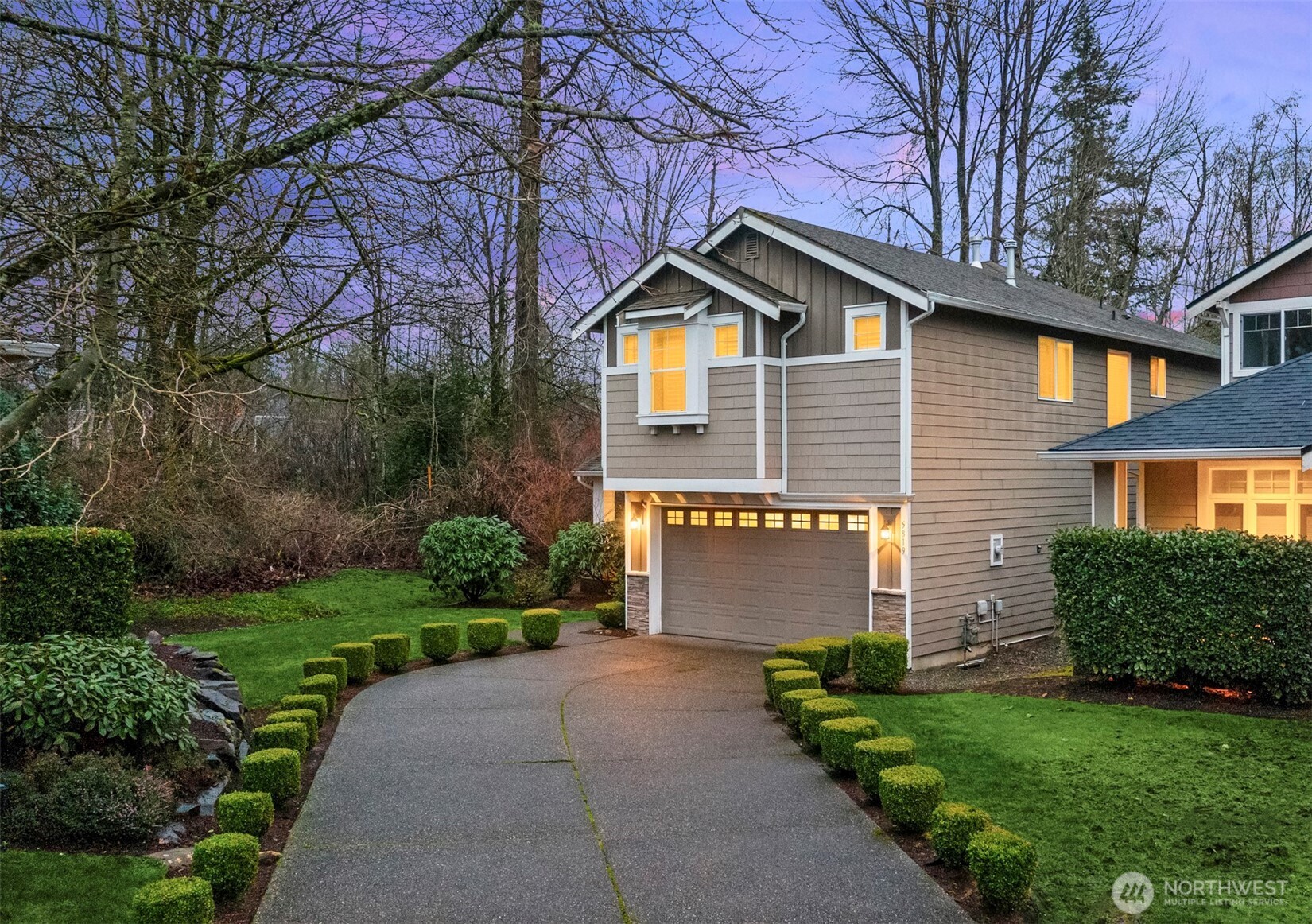 5819 Northeast 1st Street Renton, WA 98059 - Photo 34 of 38 a front view of a house with a yard and garage