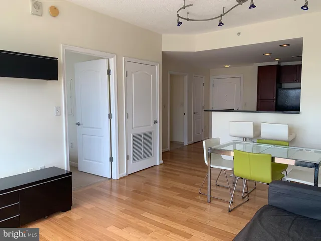 a view of kitchen with furniture and wooden floor
