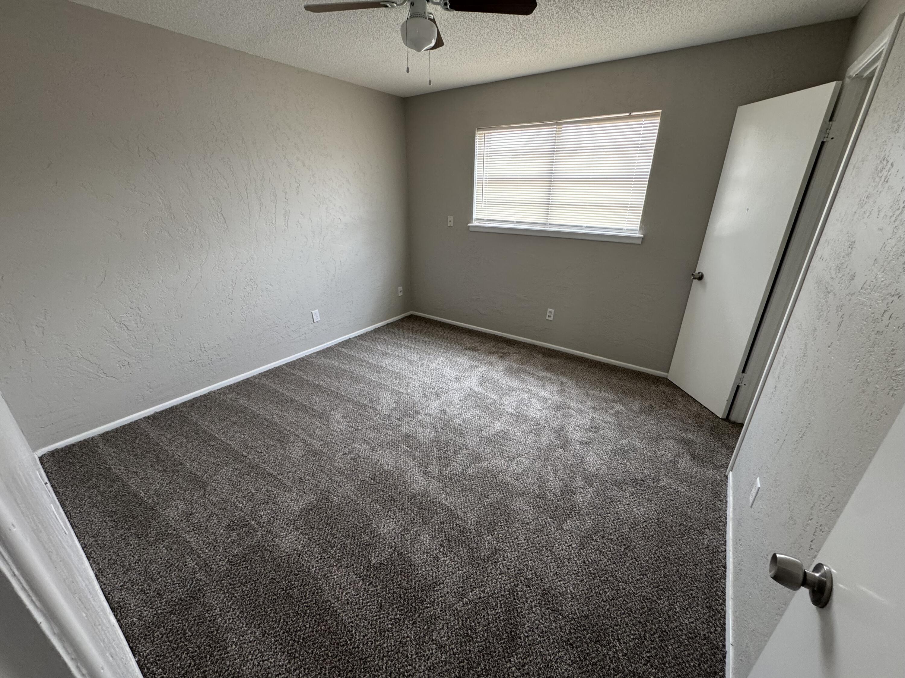 5236 17th Street Lubbock, TX 79416 - Photo 10 of 14 an empty room with a window