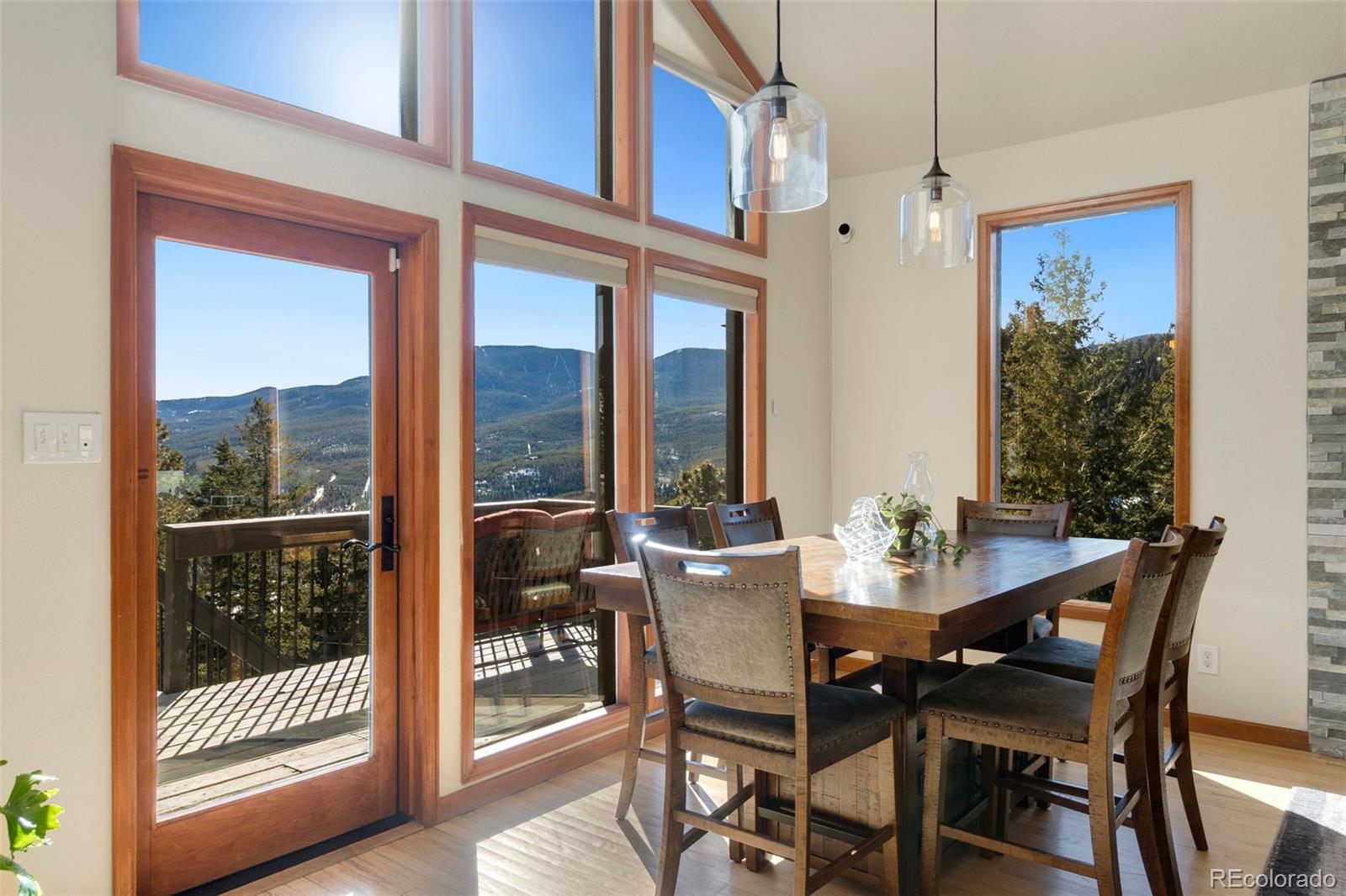 33773 Elk Run Evergreen, CO 80439 - Photo 12 of 35 a view of a dining room with furniture window and wooden floor