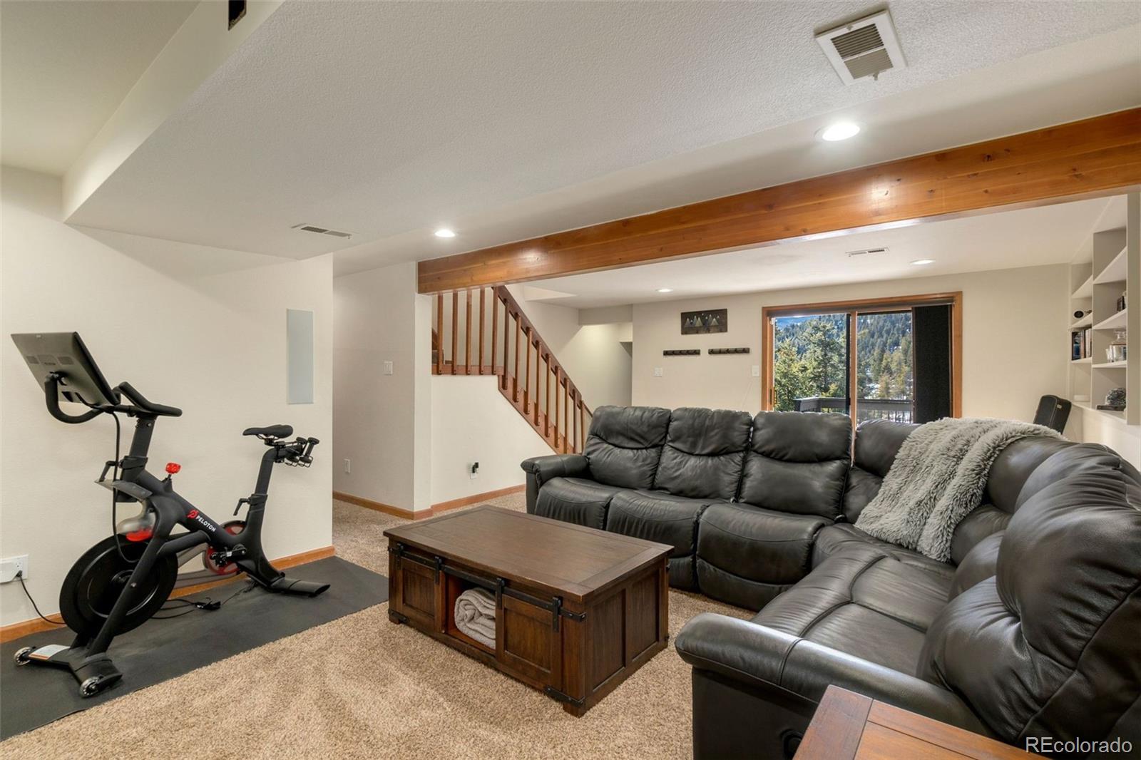 33773 Elk Run Evergreen, CO 80439 - Photo 13 of 35 a living room with furniture a air conditioner and a window