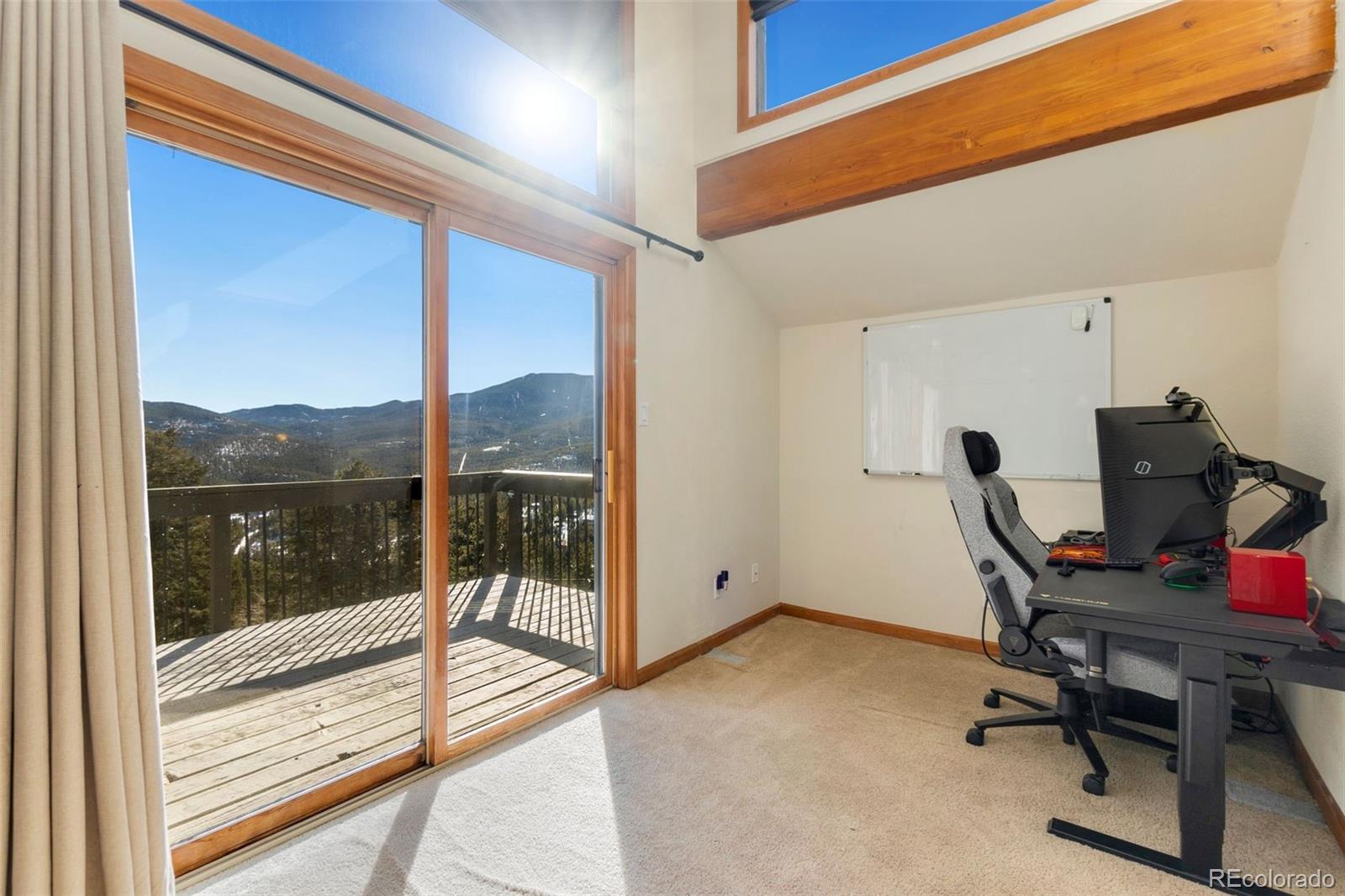 33773 Elk Run Evergreen, CO 80439 - Photo 22 of 35 a view of workspace with a large window and chair