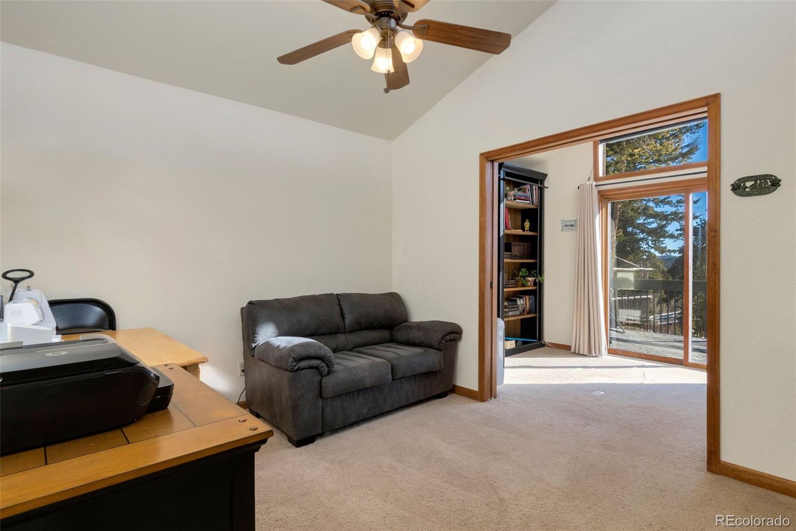33773 Elk Run Evergreen, CO 80439 - Photo 23 of 35 a living room with furniture and a window