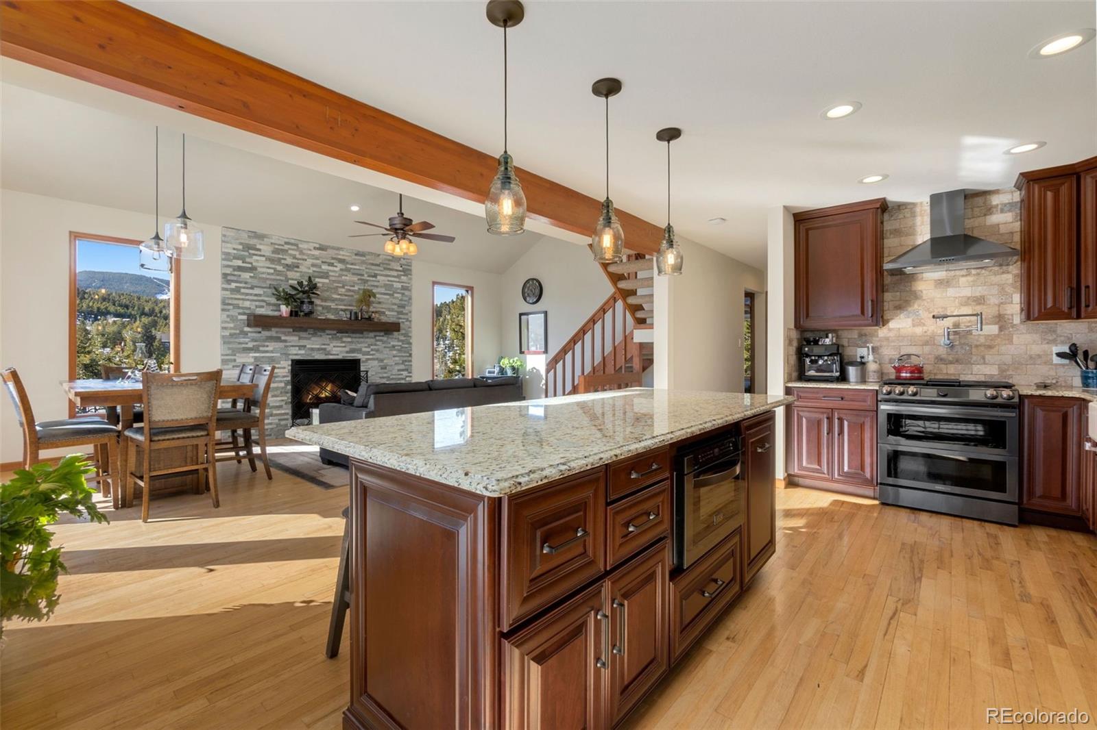 33773 Elk Run Evergreen, CO 80439 - Photo 10 of 35 a kitchen with stainless steel appliances granite countertop a stove and a refrigerator