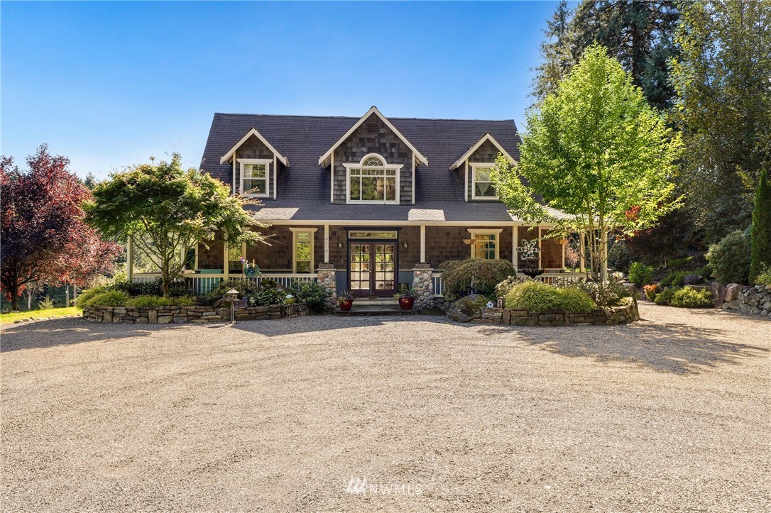 18318 Butler Road Snohomish, WA 98290 - Photo 1 of 25 a front view of a house with a yard