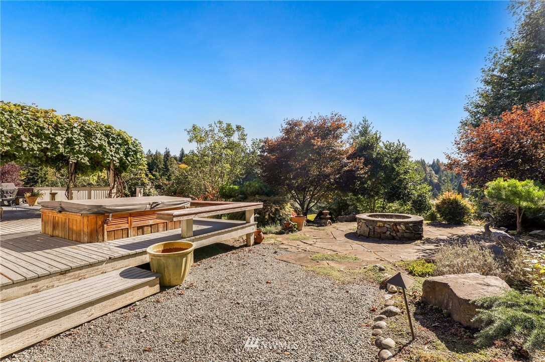18318 Butler Road Snohomish, WA 98290 - Photo 22 of 25 a view of an outdoor sitting area with fire pit
