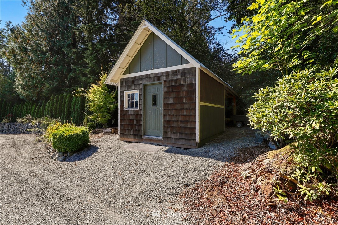 18318 Butler Road Snohomish, WA 98290 - Photo 23 of 25 a view of a house with a yard and garage