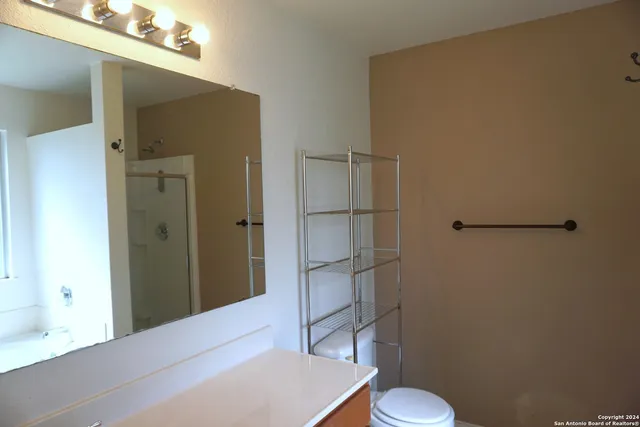 a bathroom with a shower and a toilet