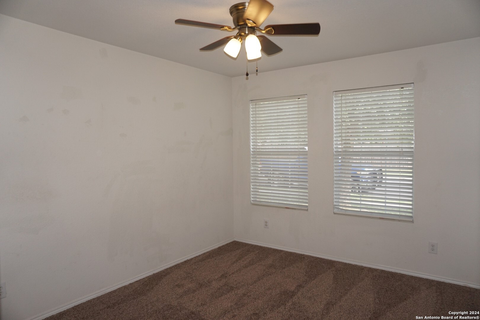 7730 Ruidoso Chase Selma, TX 78154 - Photo 14 of 22 an empty room with a window and a fan