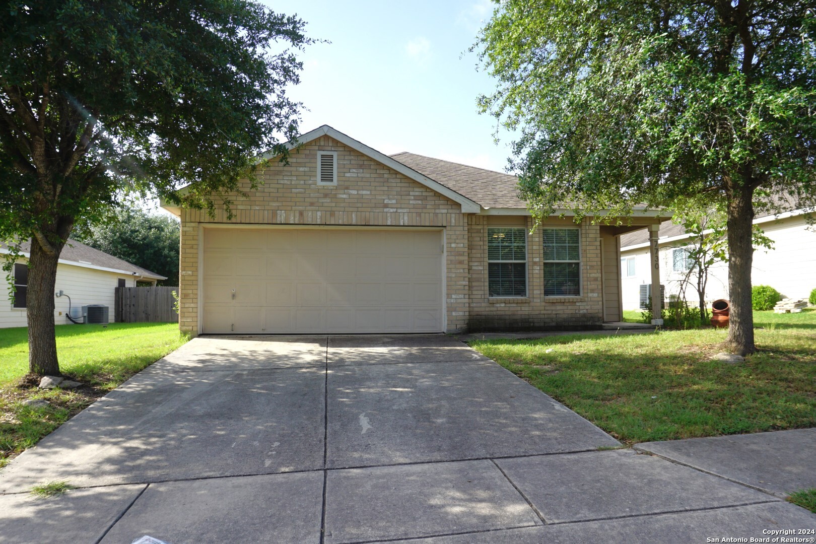 7730 Ruidoso Chase Selma, TX 78154 - Photo 2 of 22 a front view of a house with a yard and garage