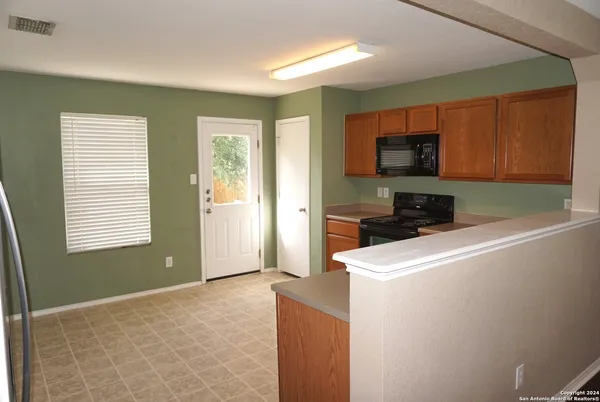 a room with storage and a window