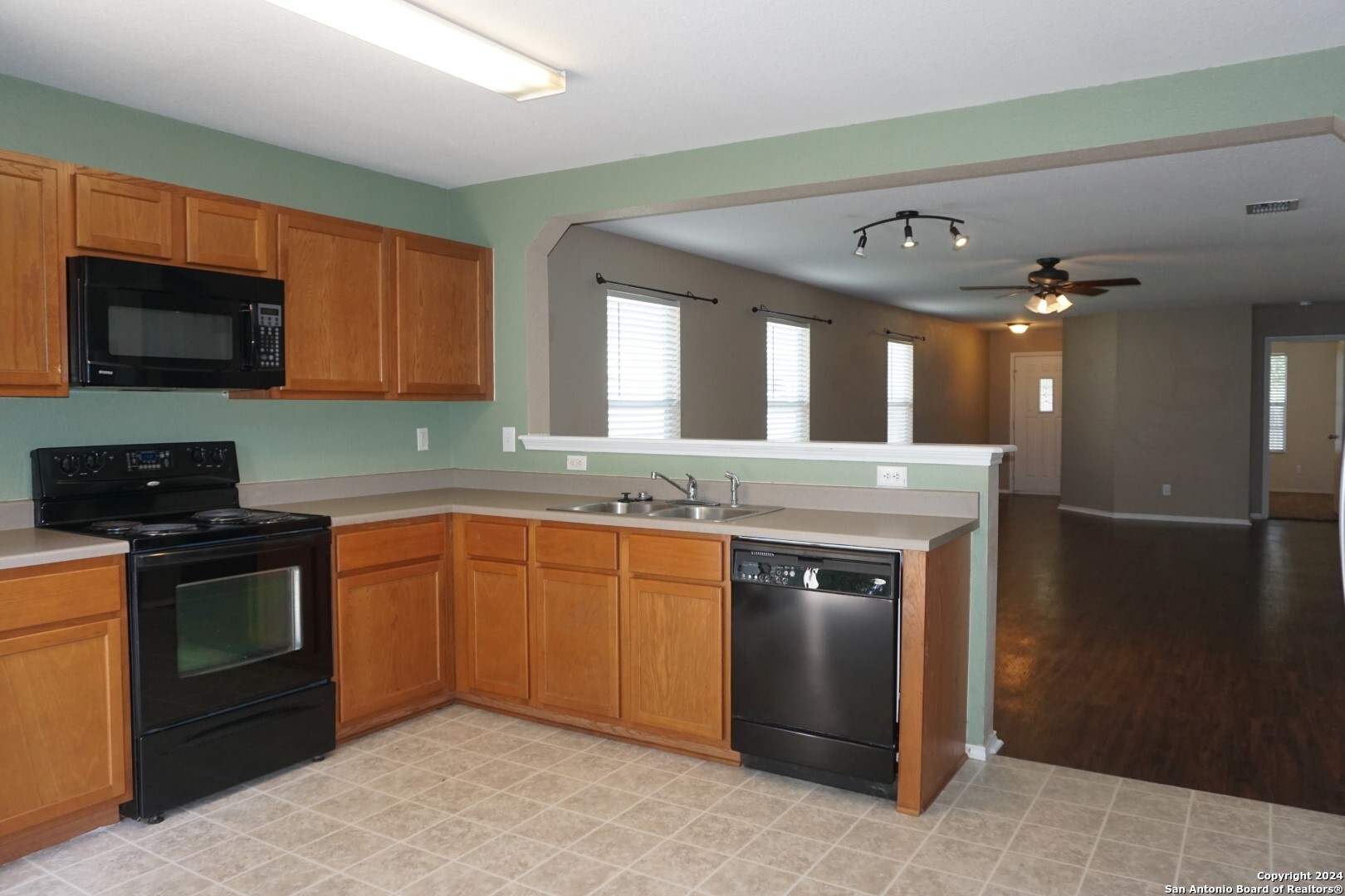 7730 Ruidoso Chase Selma, TX 78154 - Photo 7 of 22 a kitchen with stainless steel appliances granite countertop a sink stove and refrigerator
