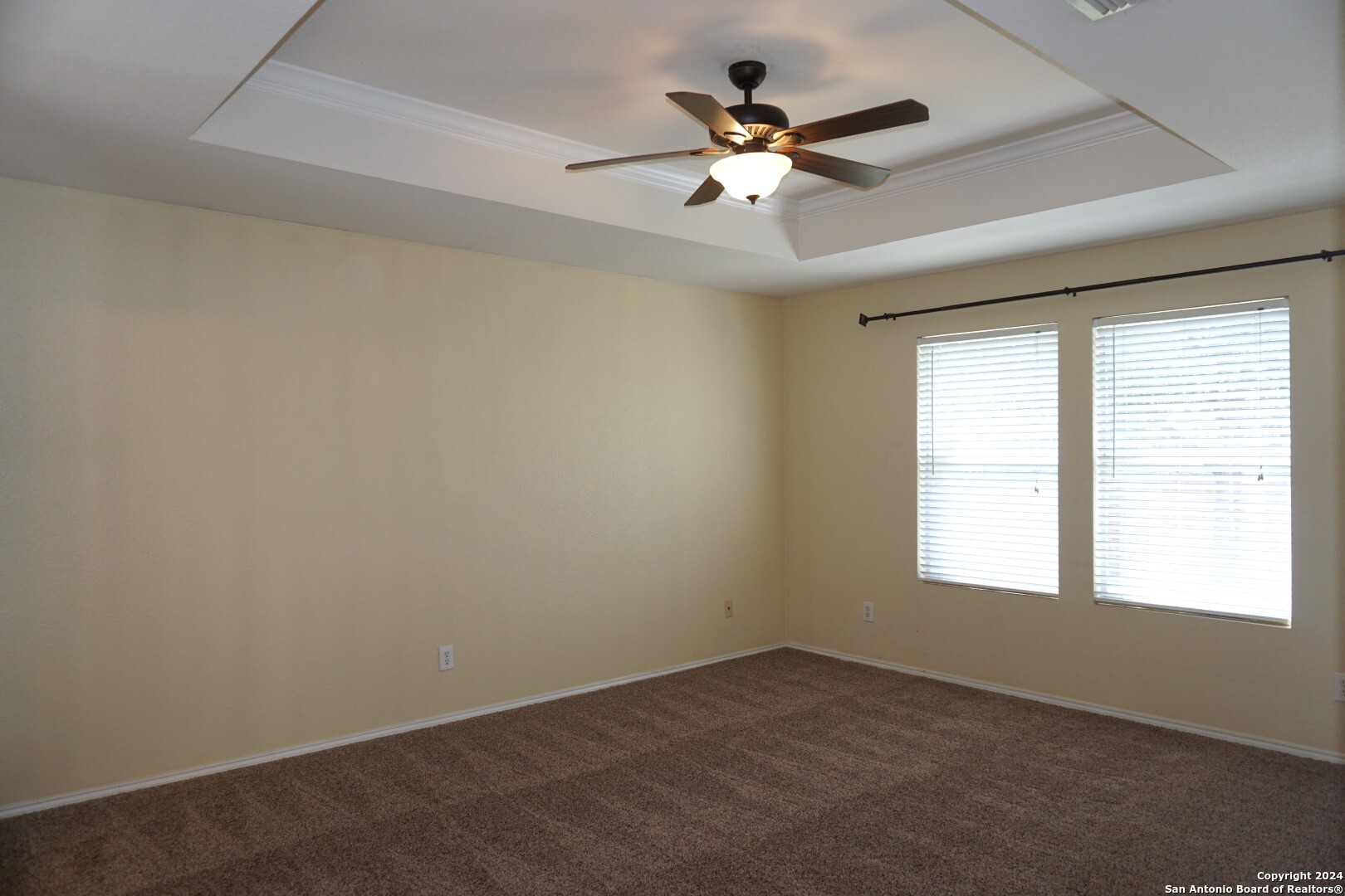 7730 Ruidoso Chase Selma, TX 78154 - Photo 10 of 22 an empty room with a window and a fan