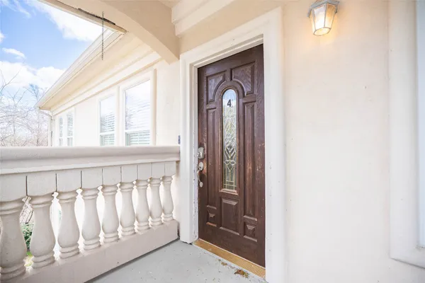 an aerial view of lake and residential houses with outdoor space