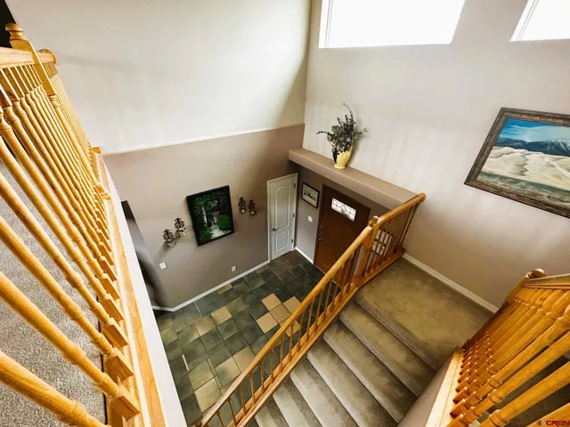 a view of a room with gym equipment and a large window