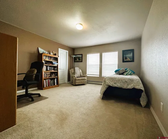 a kitchen with stainless steel appliances granite countertop a sink a stove and refrigerator