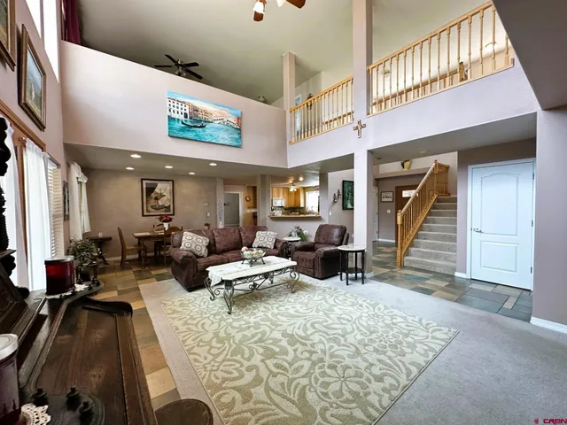 a view of a yard with plants and trees