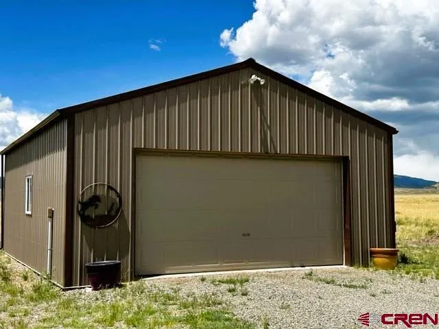a view of a house with backyard and porch