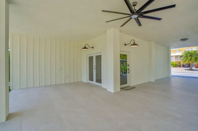 a view of room with window and wooden floor