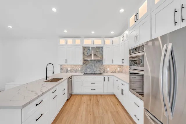 a view of an entryway with wooden floor