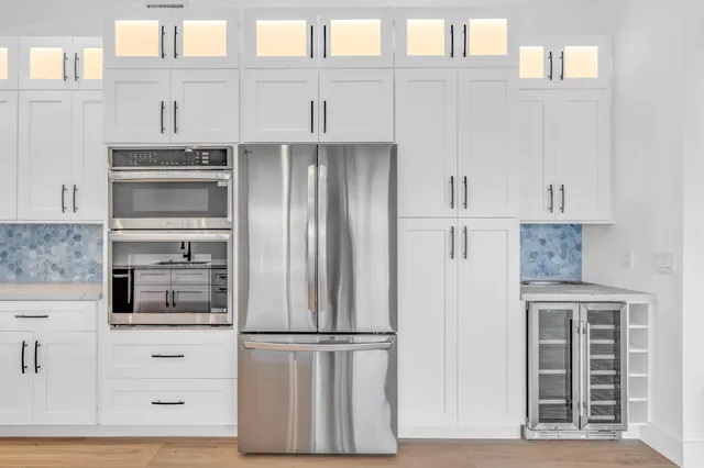 a view of an entryway with wooden floor