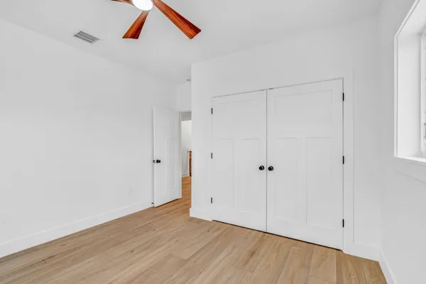 a view of an entryway with wooden floor