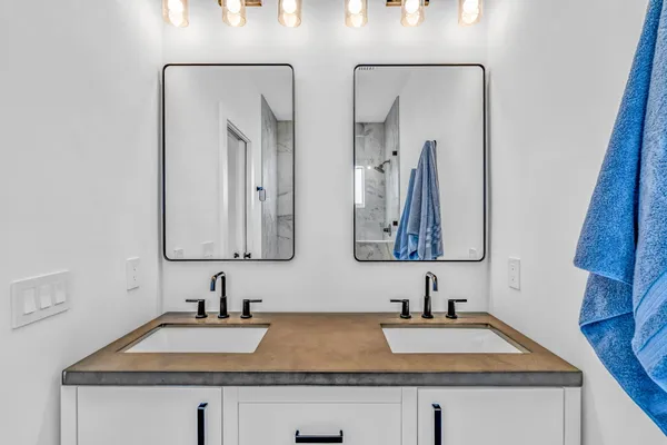 an empty room with ceiling fan and wooden floor