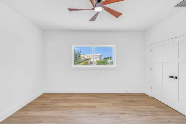 a view of a room with wooden floor