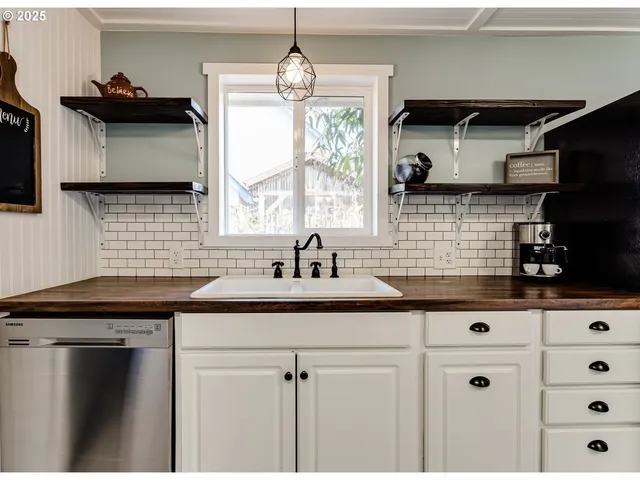 a kitchen with a sink and cabinets
